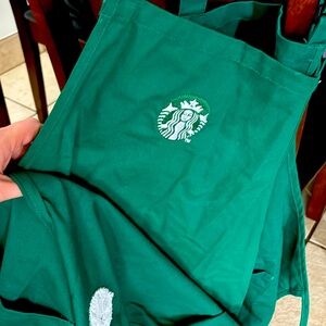 3 green Starbucks aprons